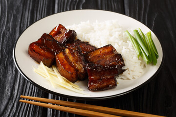 Famous Dish in Okinawa Rafute Dongbo Pork closeup in the plate on the table. Horizontal