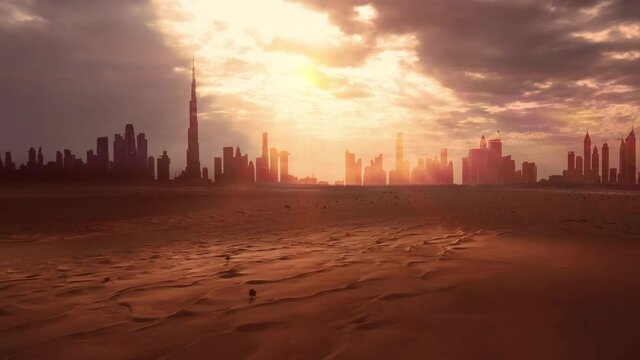 AERIAL. View to Dubai city silhouette from the desert at sunset. 