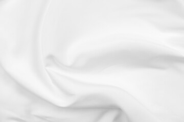 Fototapeta premium Abstract white fabric texture background. Cloth soft wave. Creases of satin, silk, and cotton.