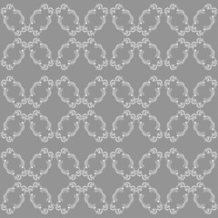Vector seamless pattern ornament for decoration and design of fabric for pastel linen, wrapping paper, gray background.