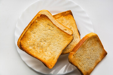 The plate is lined with crispy toast for breakfast. View from above. Isolated