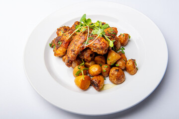 Grilled chicken wings with roasted potatoes