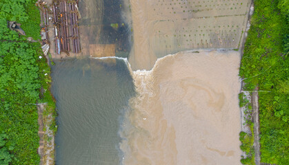The mud flows into the river and pollutes the river. 