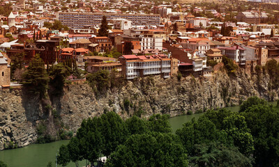 Panoramic view of Tbilisi. The houses are built on a cliff face above the Kura River.