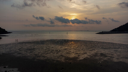 Mud beach at low tide at sunset 