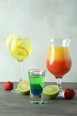 Fresh summer cocktails on gray textured table