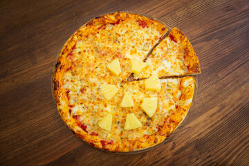 Pizza with pineapple and cheese and chicken. Hawaiian pizza. view from above
