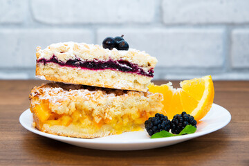 pie with fruit filling. pieces of pie on a plate decorated with berries. Food concept.