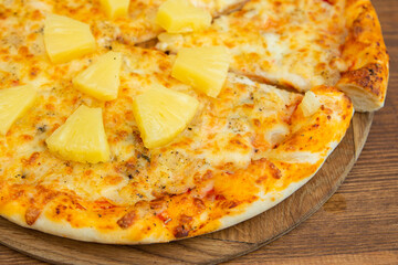 Hawaiian pizza. Pizza with pineapple and cheese and chicken. Close-up