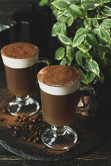 Concept of delicious drink with Irish coffee on wooden table
