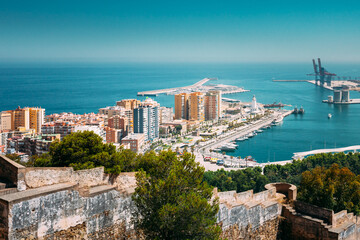 Fototapeta premium Malaga, Spain. Elevated View, Cityscape View Of Malaga, Spain. Old Fort Walls And Residential Houses