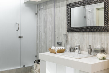 Fototapeta na wymiar Modern shower room interior with washbasin and mirror