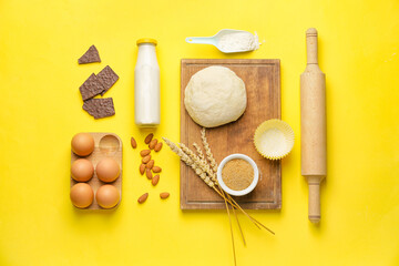 Ingredients for preparing bakery and kitchen utensils on color background