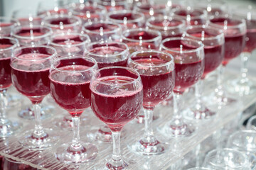 a lot of red wine glasses