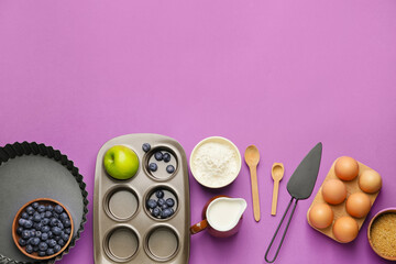 Obraz premium Ingredients for preparing bakery and kitchen utensils on color background