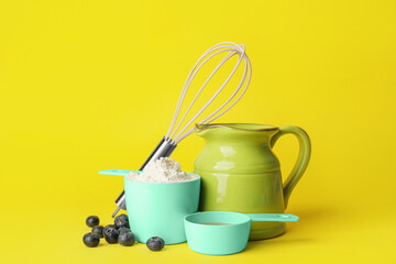 Ingredients for preparing bakery and kitchen utensils on color background