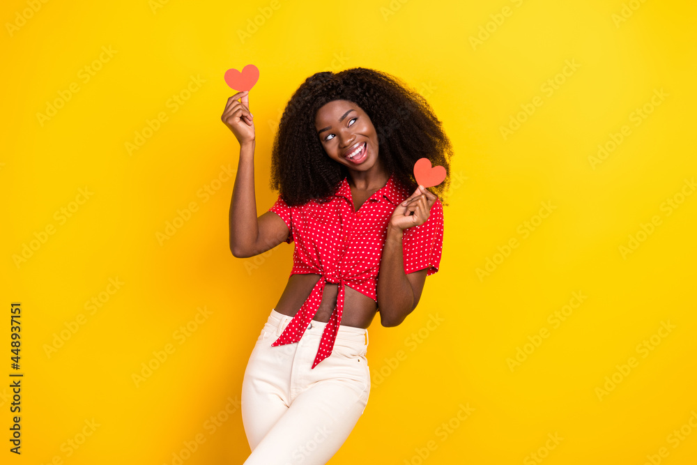 Sticker Photo of nice optimistic brown hair lady hold heart look empty space wear shirt isolated on yellow color background