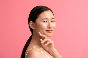 Beautiful young woman on color background