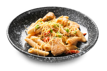 Plate with tasty cajun chicken pasta on white background