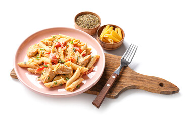 Plate with tasty cajun chicken pasta on white background
