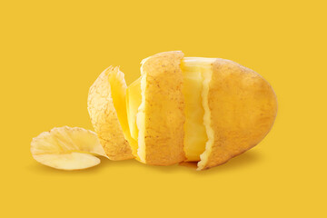 Spiral Peeled Potatoes isolated on yellow background.