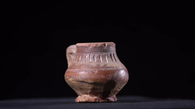 spotlight on a antique old jar