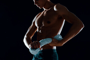 Obraz na płótnie Canvas man in black shorts pumped up body workout fitness motivation