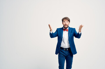 man in professional suit posing fashion manager light background