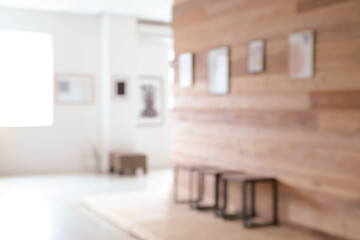 Interior of modern art gallery, blurred view