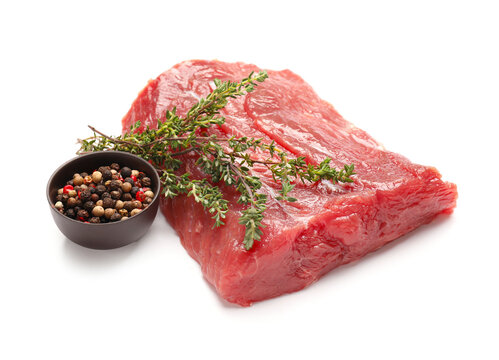 Raw beef brisket with spices on white background