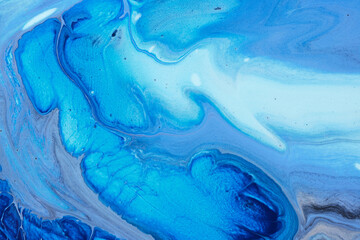 Blue abstract flowing paint background