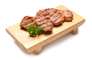 Wooden board with tasty beef steaks on white background