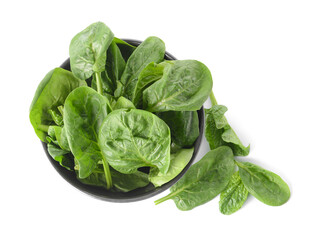 Bowl with fresh spinach leaves on white background