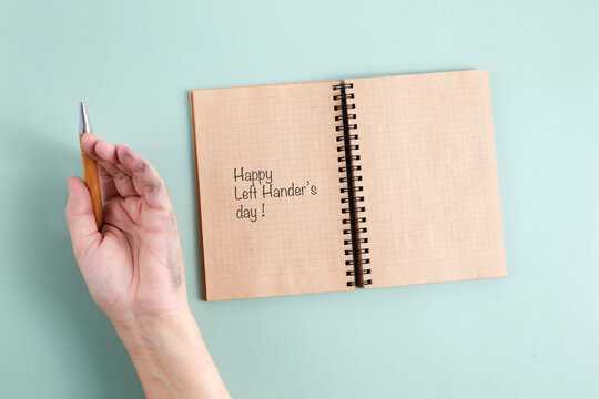 Dirty left hand after writing. Left hander's day concept.