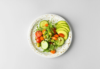 Plate with tasty vegetable salad on white background