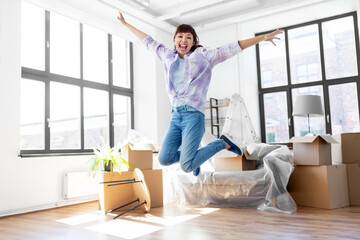 people, repair and real estate concept - happy smiling asian woman with stuff moving to new home...