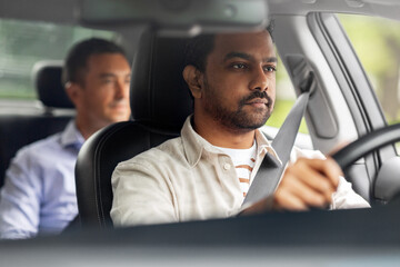 transportation, vehicle and people concept - indian male driver driving car with passenger