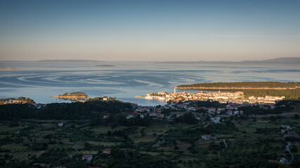 Early morning light on the old town of Rab and the island viewing form the hill of Kamenjak