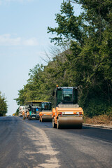 Fototapeta na wymiar Road service repairs the highway