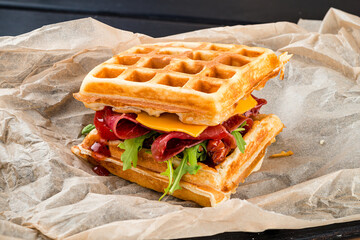 viennese waffles with ham parma and dried tomatoes