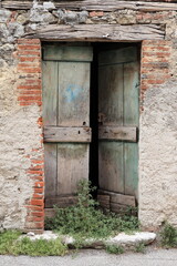 Old Weathered Wooden Open Door in Stone Building in Central Italy Rural Village