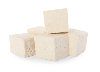 Cubes of delicious raw tofu on white background