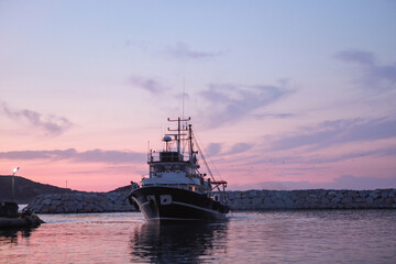 Fototapeta premium An evening on the Aegean coast and the fishing boat is ready for fishing.