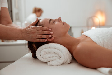 Obraz na płótnie Canvas Nice woman receiving professional massage in spa salon