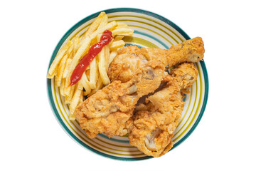 Plate with several fried chicken leg and fries on a light background. View from above