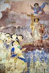 illustrations from the bible on the wall of an abandoned temple