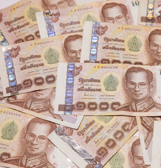 stack of Thai money banknotes baht on white background