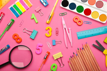 School supplies on pink background. Back to school concept.