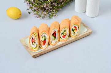 A set of beautiful canapes on a table with a gray tablecloth. Buffet table. Catering