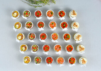 A set of beautiful canapes on a table with a gray tablecloth. Buffet table. Catering
